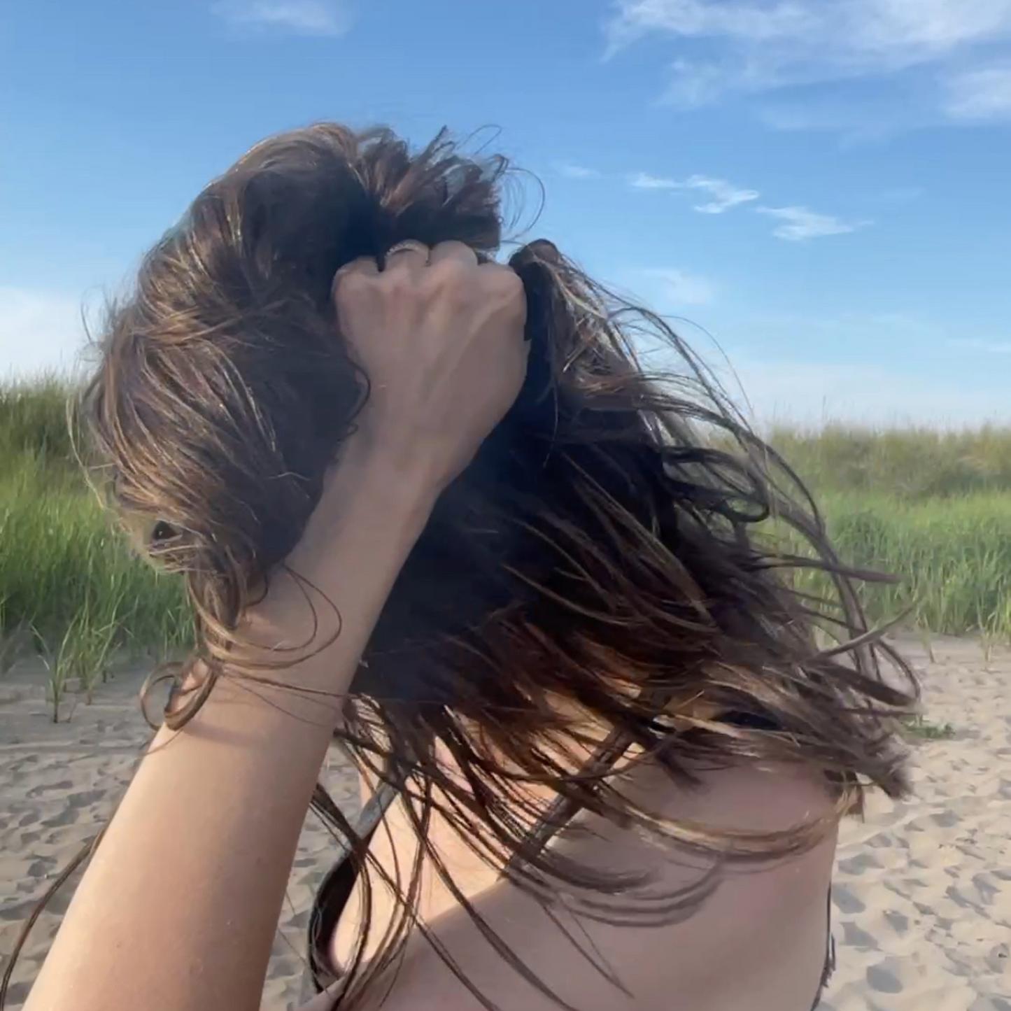 Person with long, beach waves. Beachy hair.