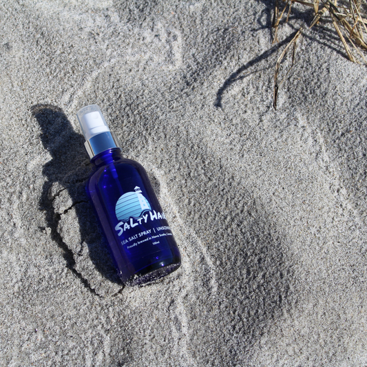 Salty Hair Sea Salt Spray Unscented Laying on Sandy Beach